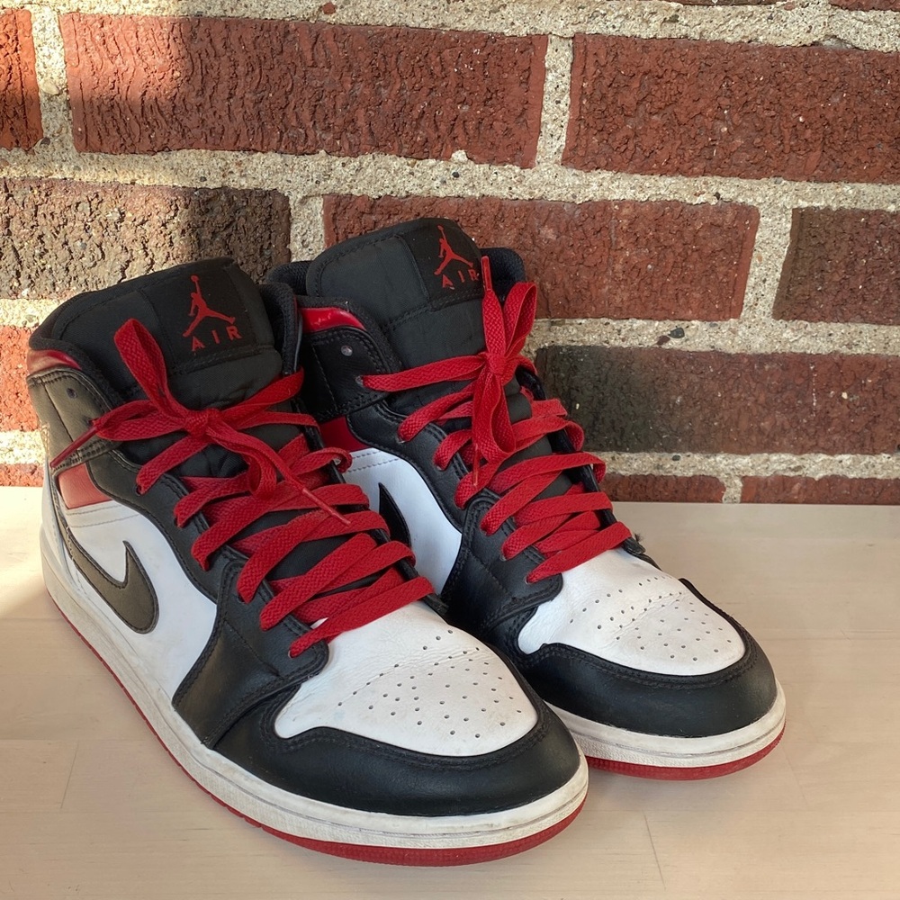 Nike Men's Black, Red, and White Air Jordan 1 Mid Sneakers